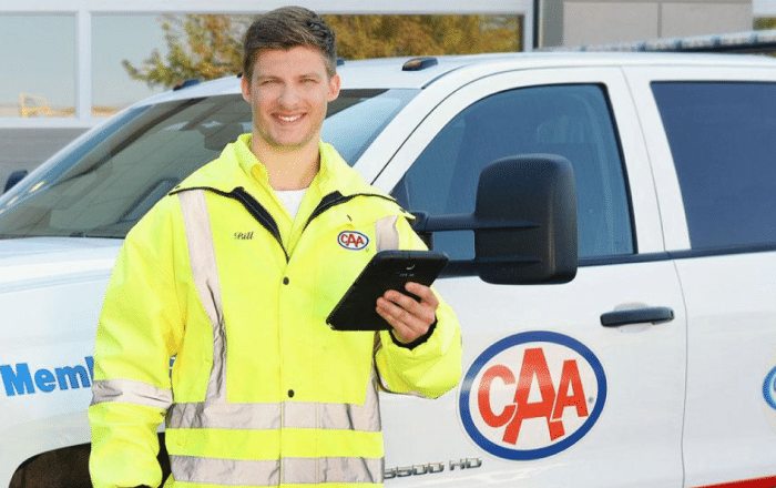 caa roadside assistance service person and truck