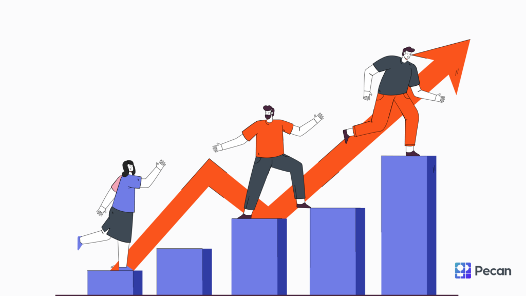 Team members climbing a bar graph